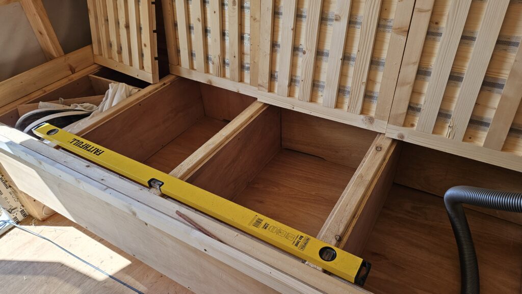 Building a Bee Bed cabin using professional construction methods.