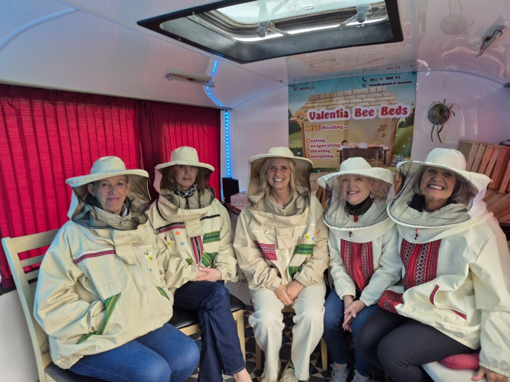 Guests enjoying a Bee Bed business experience while learning about honey bees at The Bee Beds Academy.